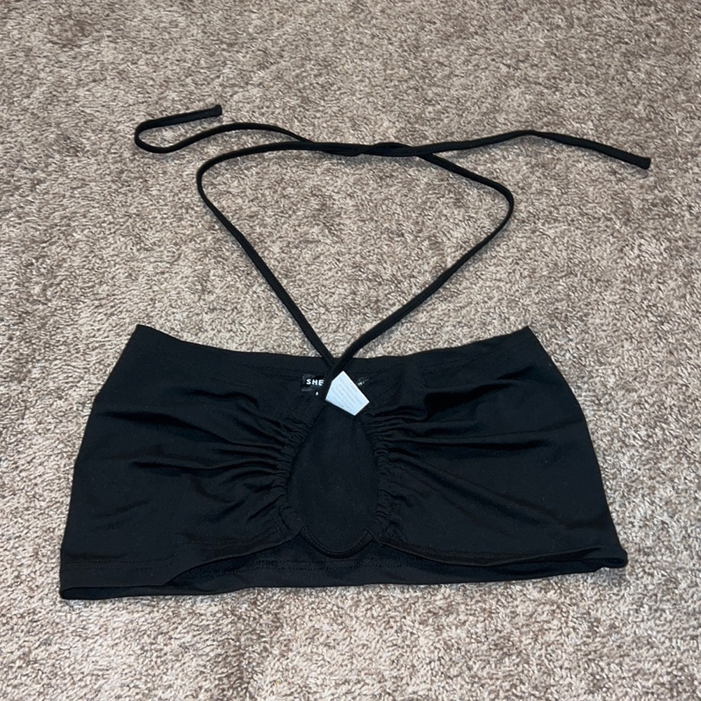 Black going out top